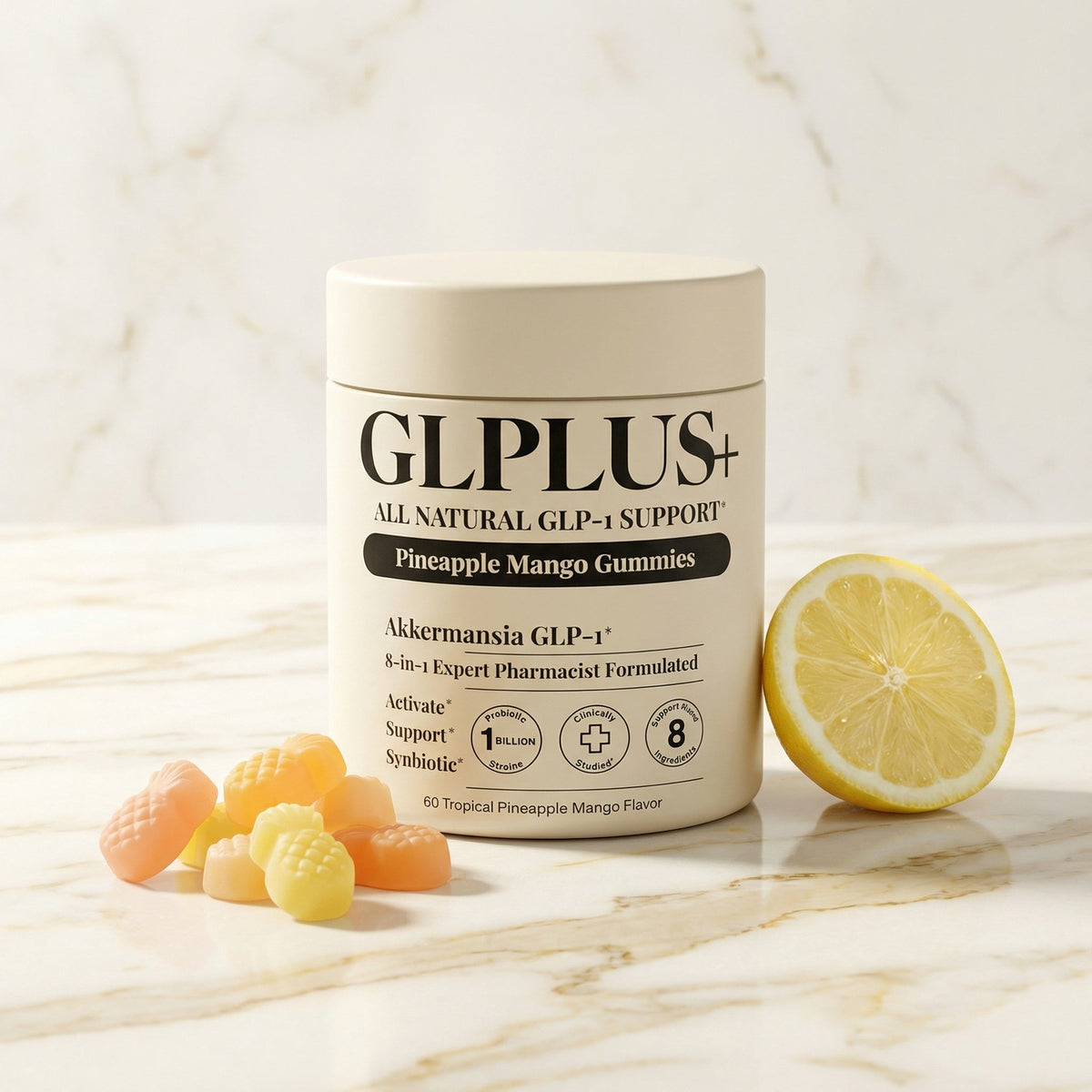 GLPLUS+ Akkermansia GLP-1 gummies on white Carrara marble with pineapple mango gummies and lemon
