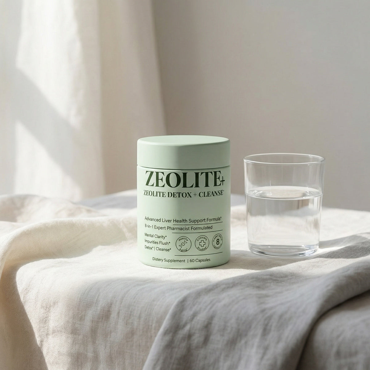 Zeolite supplement on clean white linen with a water glass in soft natural light